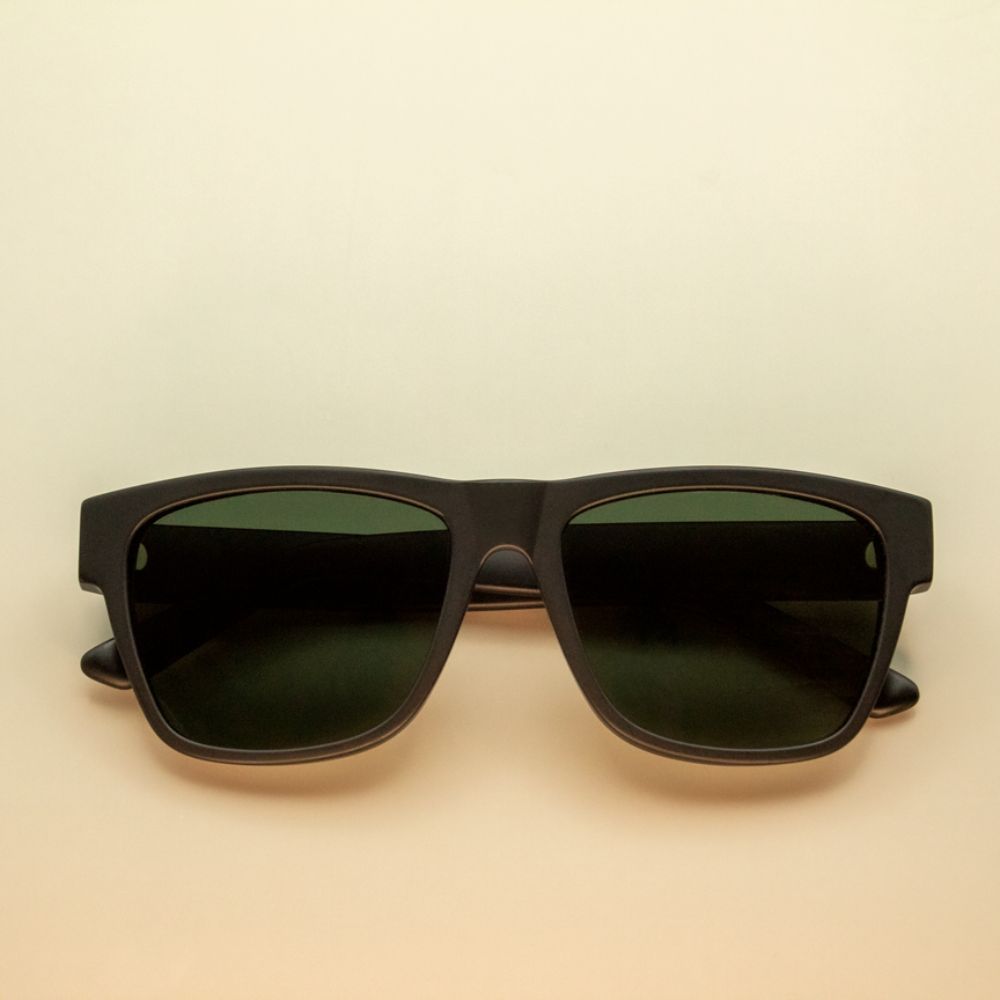 vintage square acetate green lens sunglasses on yellow background